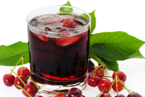 Red drink and ripe cherry berries